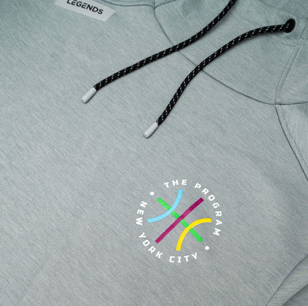 Closeup shot of the The Program NYC logo on the The Program NYC heather grey hoodie
