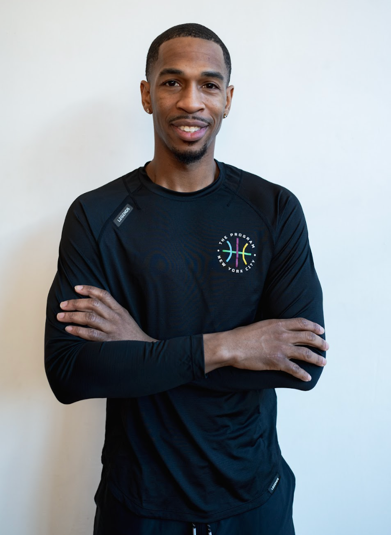 Photo of a guy wearing the The Program NYC black long-sleeve t-shirt