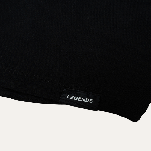Closeup of the Legends logo on the black The Program NYC shorts