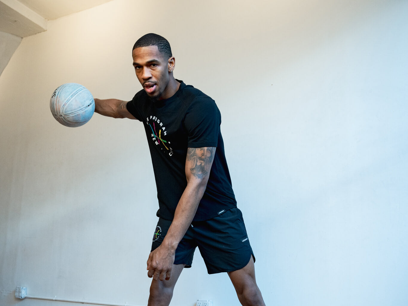 Basketball player wearing The Program NYC black t-shirt